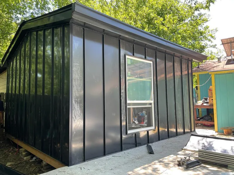 Black standing seam metal wall panels for Roof Inspection in Palmetto Estates